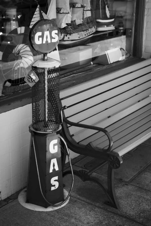 the gas pump in front of a store sells various types of shoes