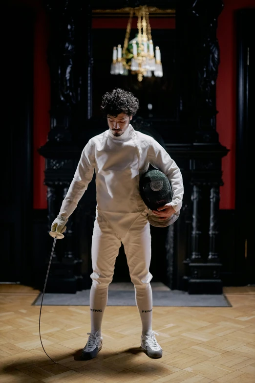 an image of a man in fencing gear