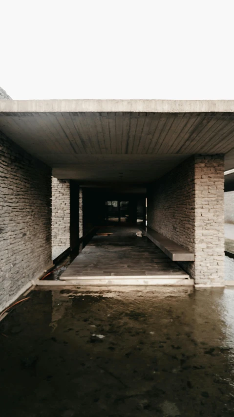 the entry to a flooded parking garage in an industrial area