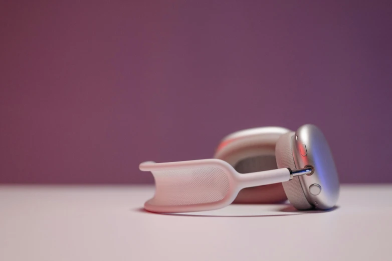 this is an iphone with a stand made out of toothbrushes