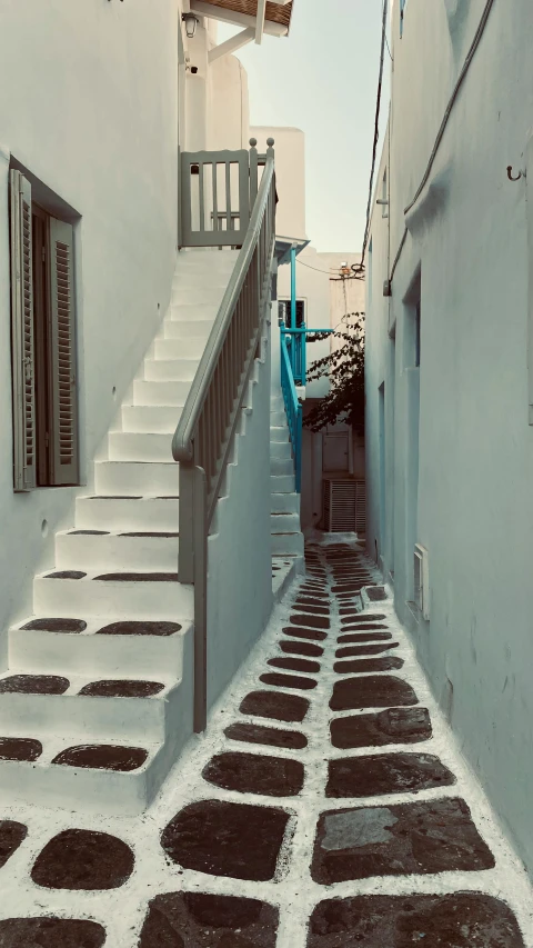 an alley in a small mediterranean village on the island of paros