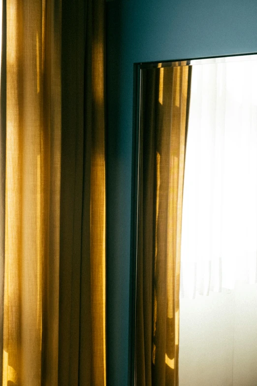 an empty room is seen through the curtains