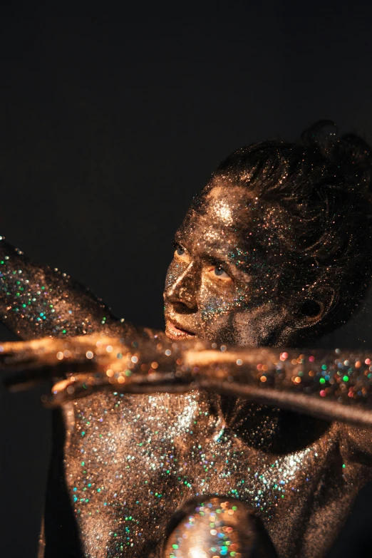 a woman's body is covered in a glitter body