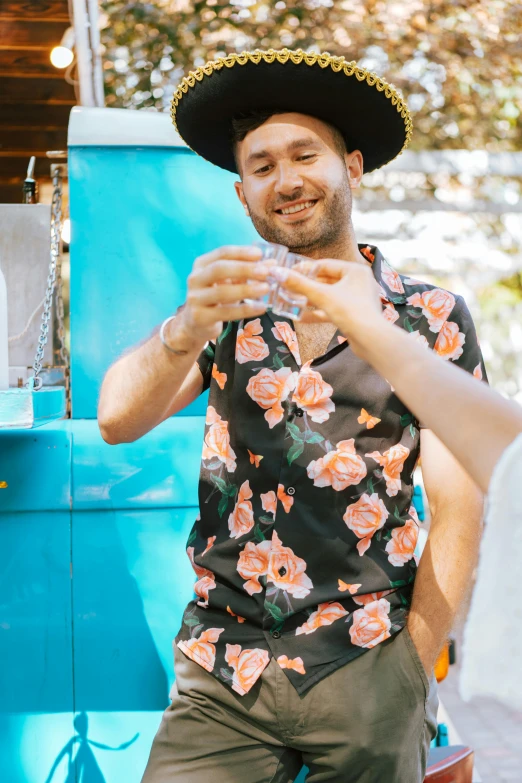 there is a smiling man wearing a mexican hat