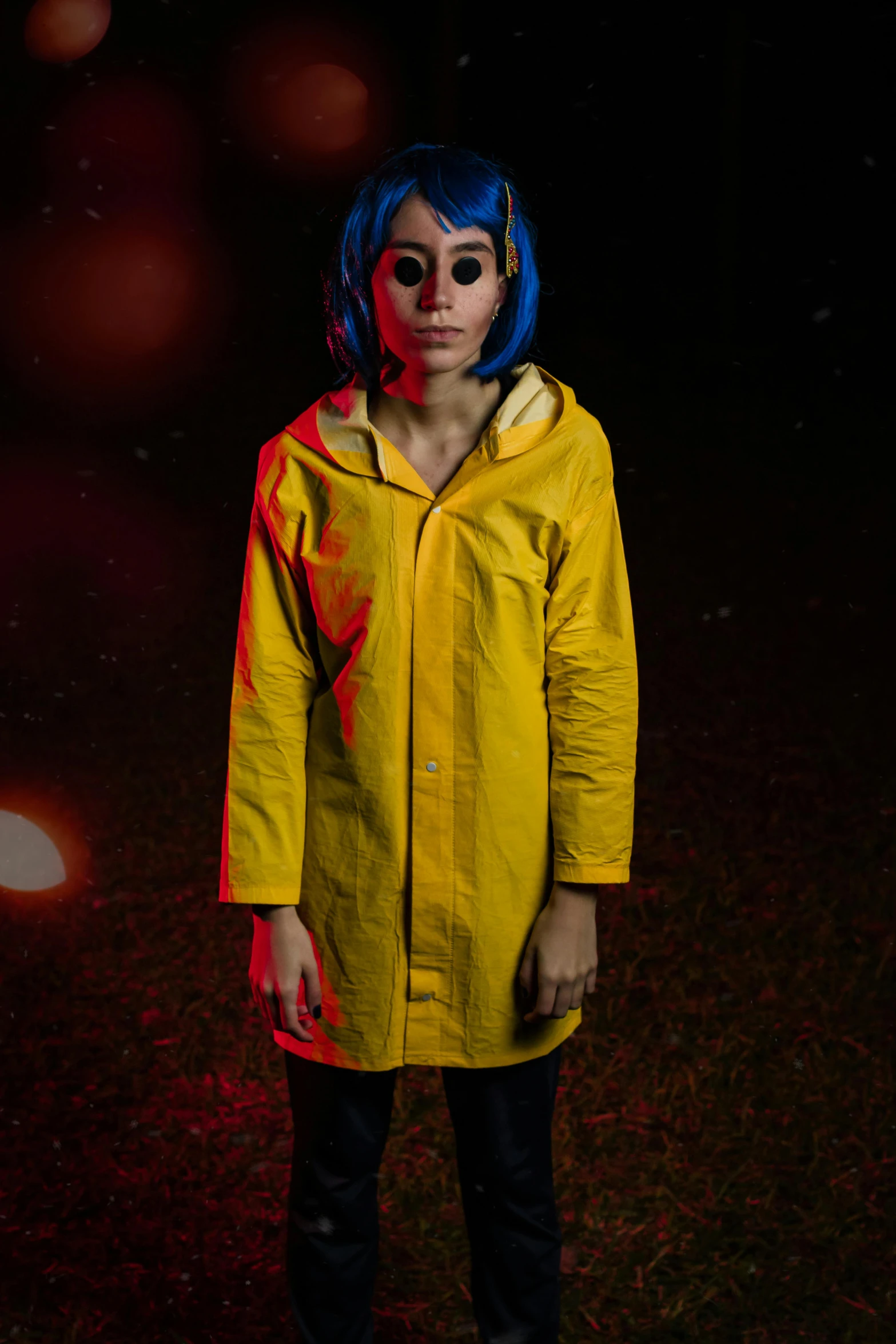 the person is wearing blue hair and a yellow raincoat