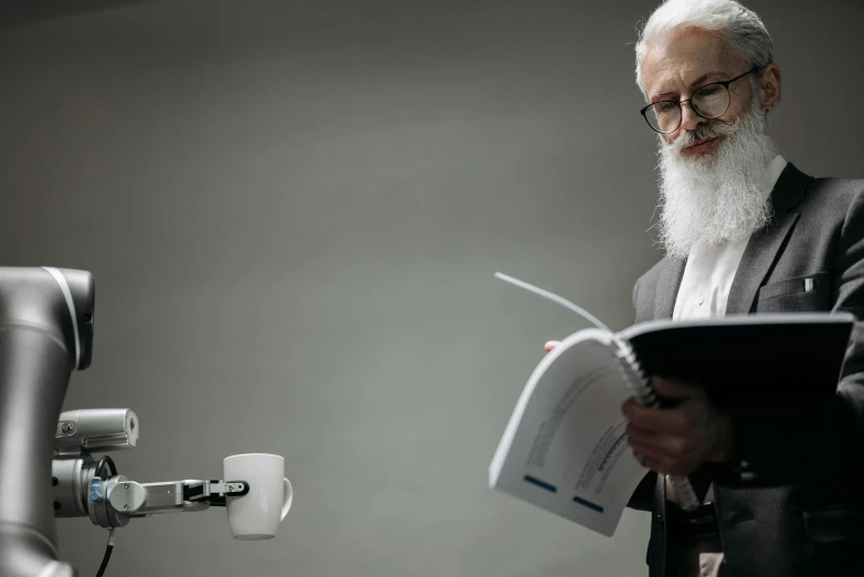 a man wearing a suit and reading a piece of paper