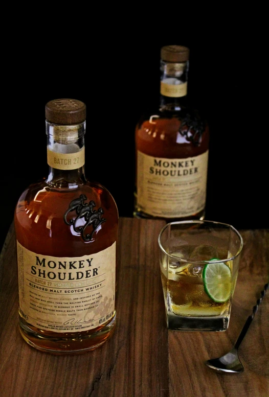 two bottles of monkey shoulder whiskey on the table