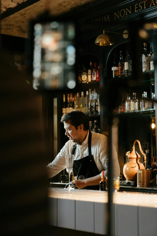 a bar with a bartender pouring drinks on the counter