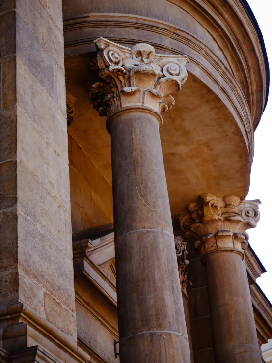 a close up of some columns with a sky background