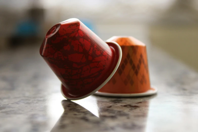 red vase on table in room with brown material