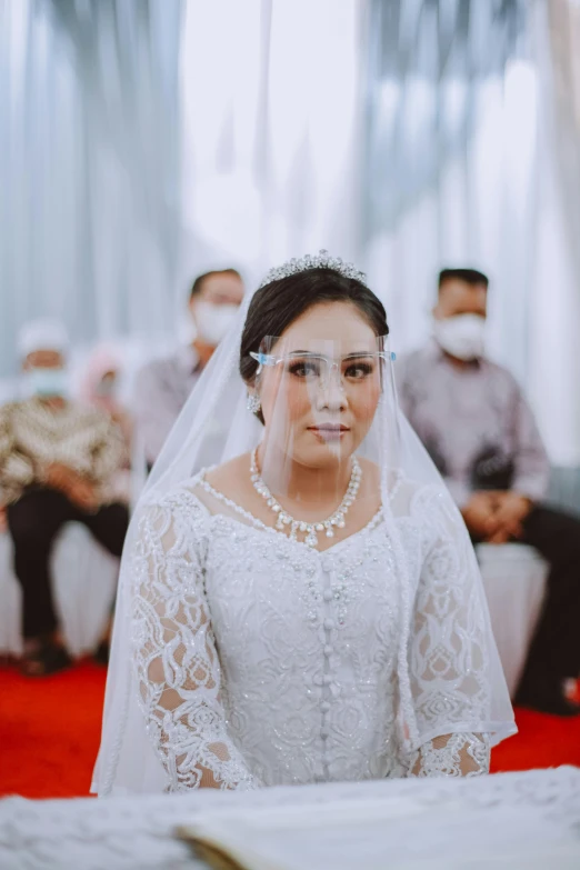 a bride in a bridal looking at the camera