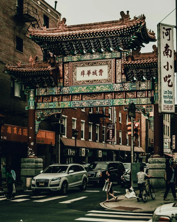 an oriental building that is next to a street