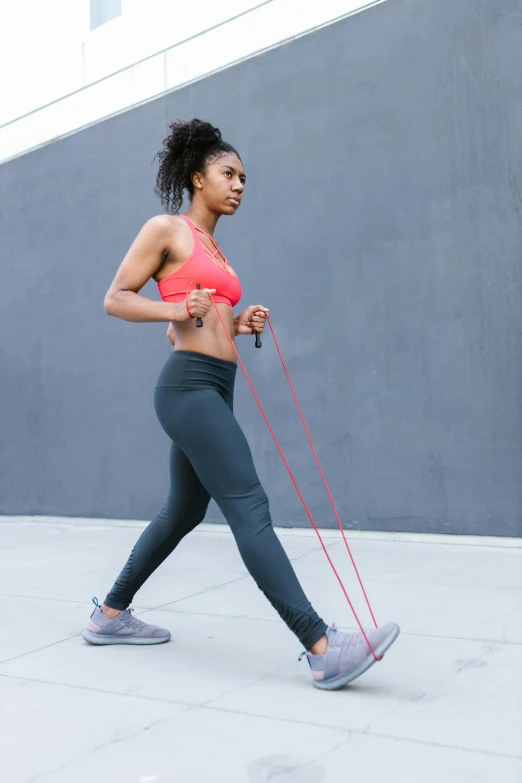 a woman is running with her dog