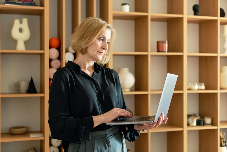 a woman holds a piece of paper in her hand