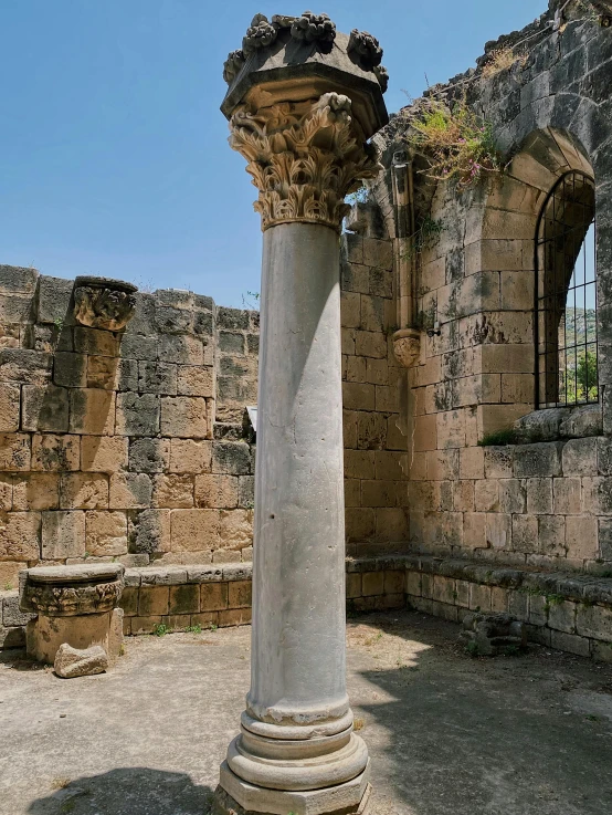 an old pillar outside a castle with no windows