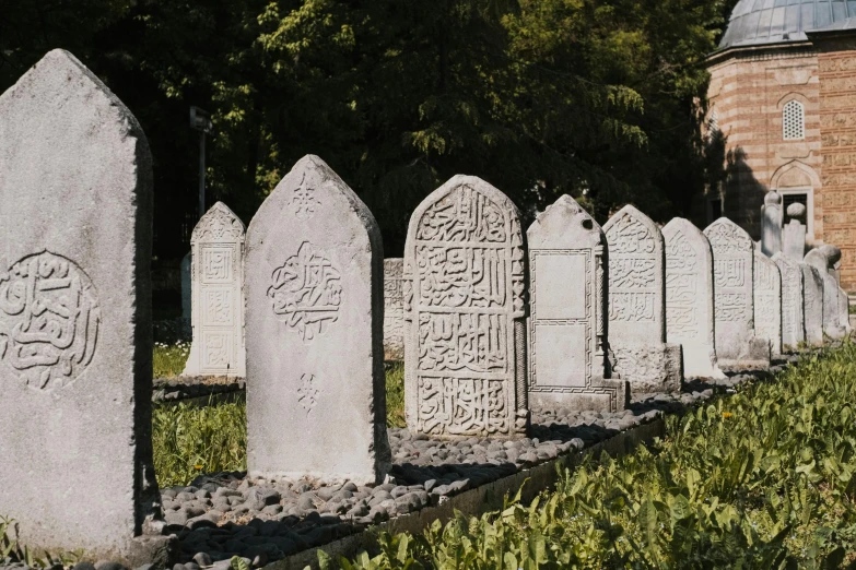 a row of graves lined with ornate letters