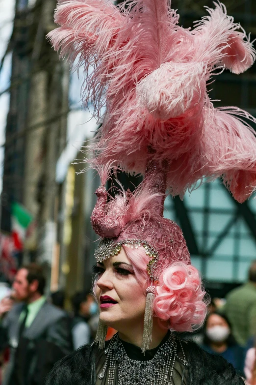 a woman in a pink wig is looking away