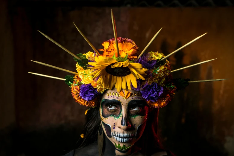 a woman with painted makeup and flowers on her head