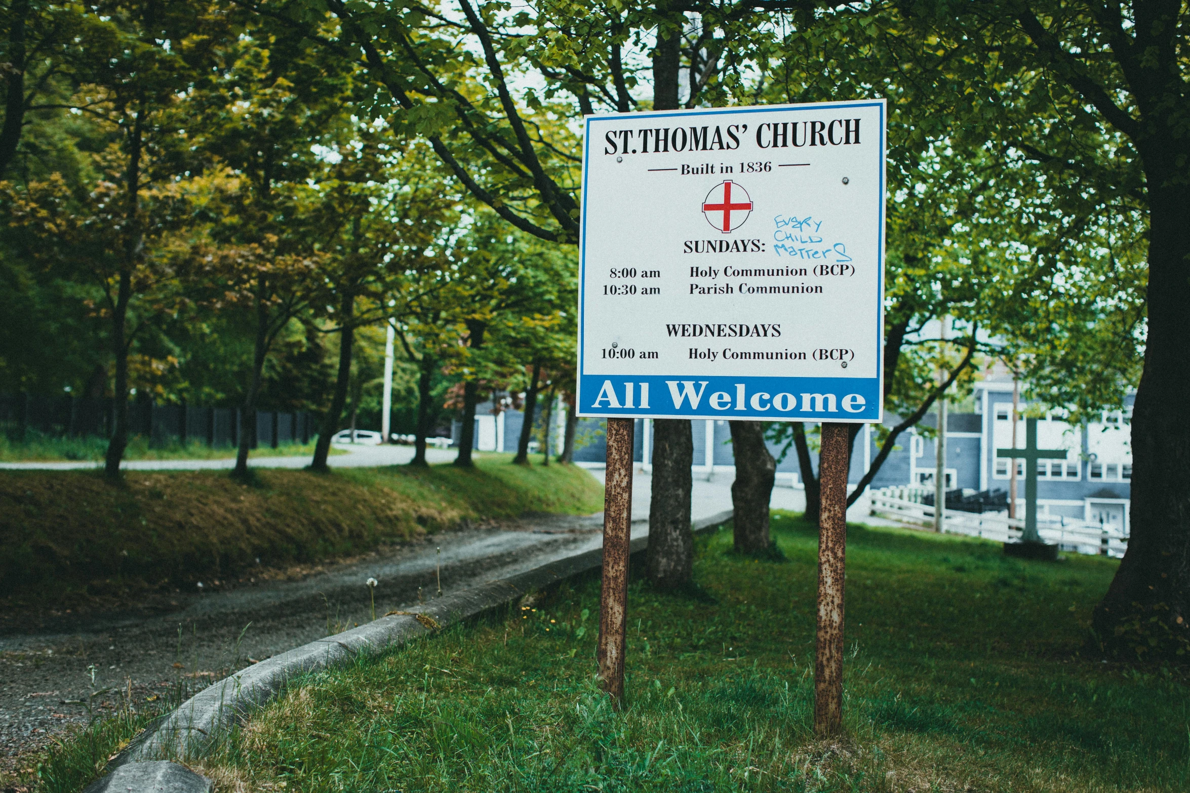 a sign in the middle of a rural area