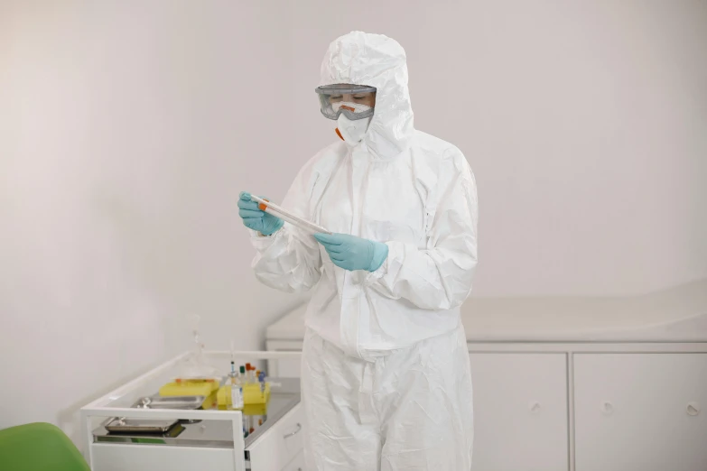 a man with goggles is standing in front of the desk