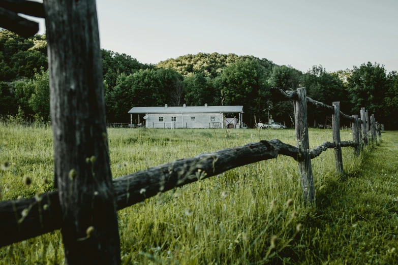 a wooden fence sits next to a house