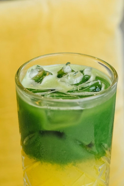 a drink with lime juice and mint in a glass