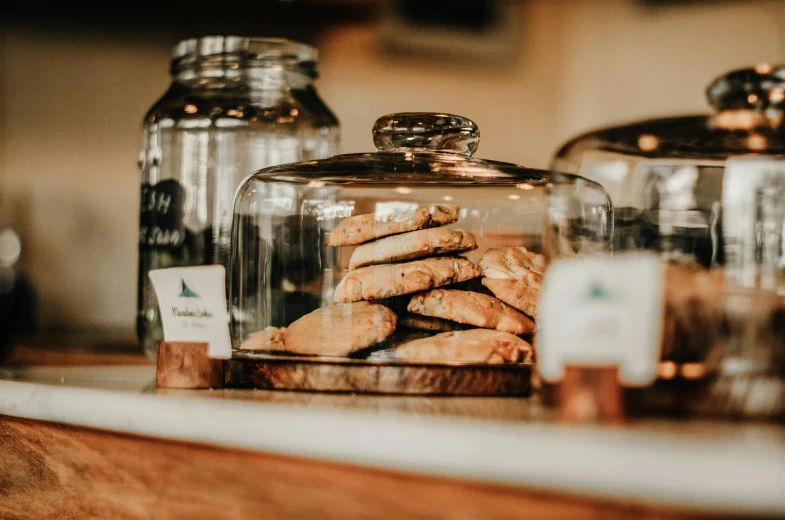 a counter with cookies under the glass