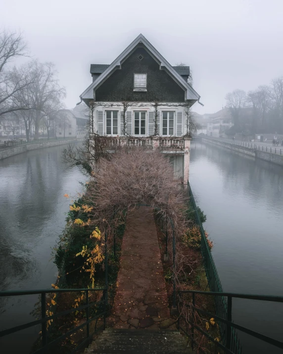 the house is surrounded by a fence and has an open yard