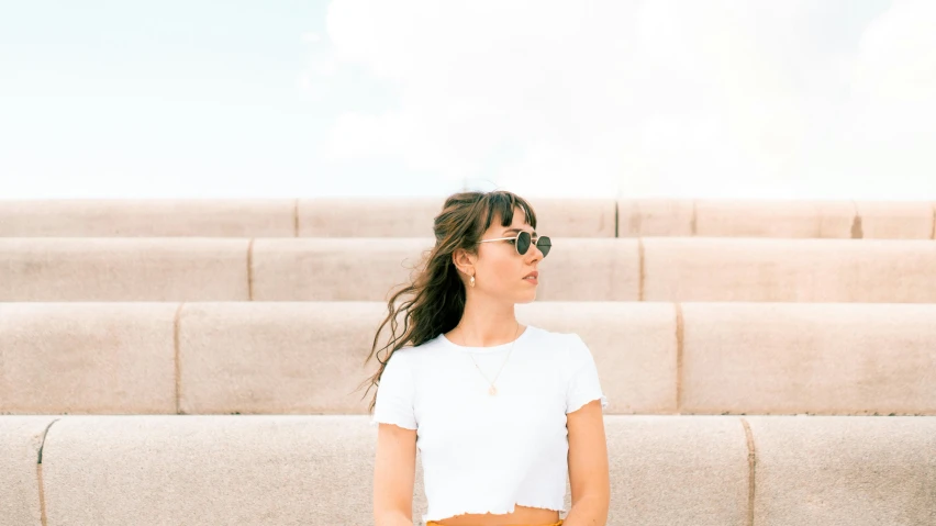 a girl looking back in some empty seating