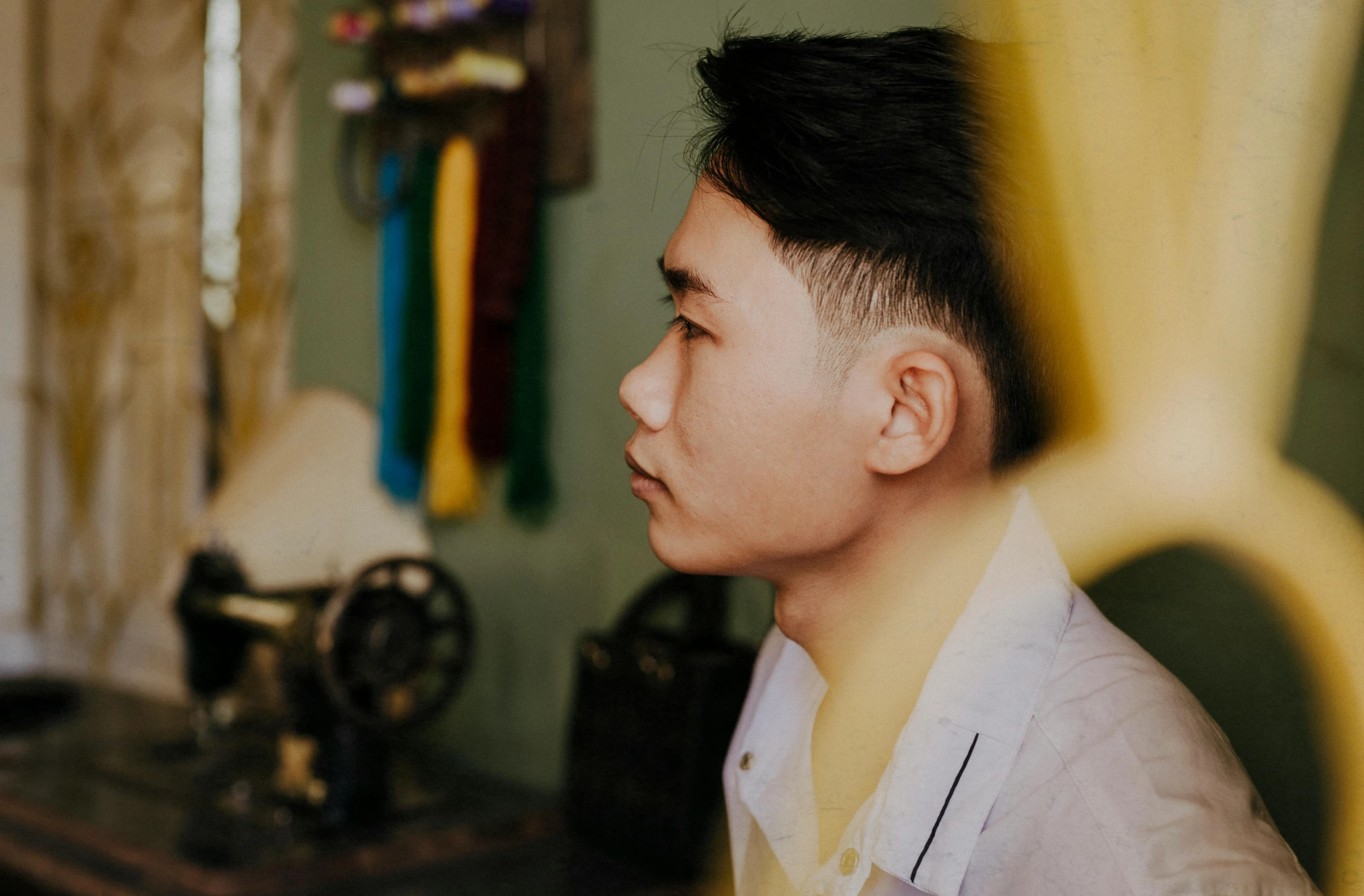 young man looking at soing on the table