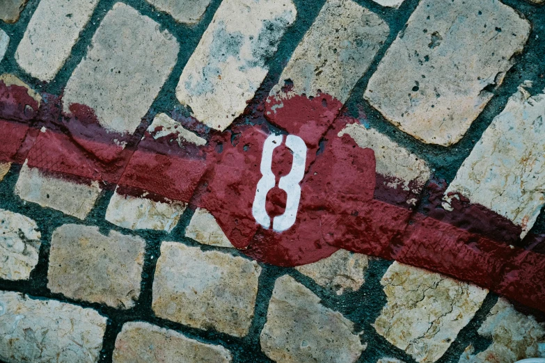 graffiti is on the stone and brick floor