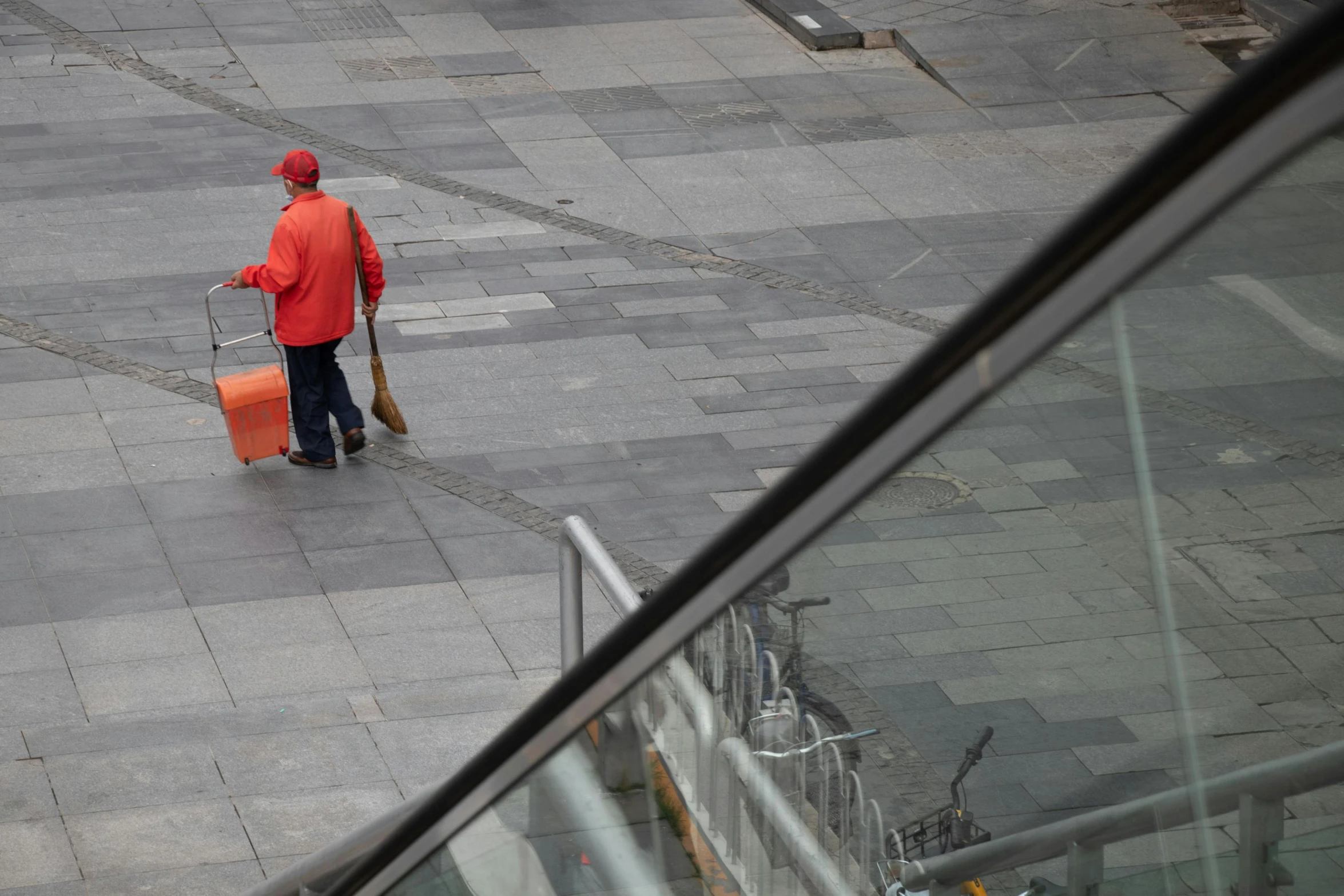 a man with a orange and black striped suitcase