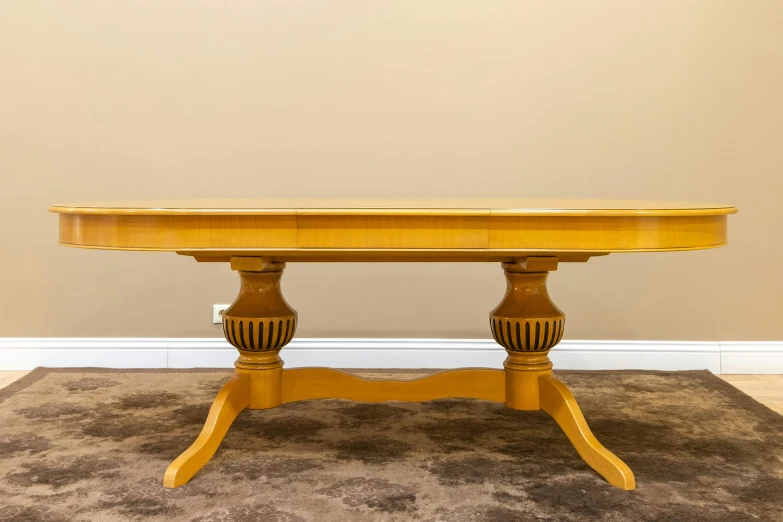 a big wooden table sitting in the corner of a room