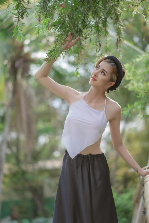 a girl in a skirt poses for a po