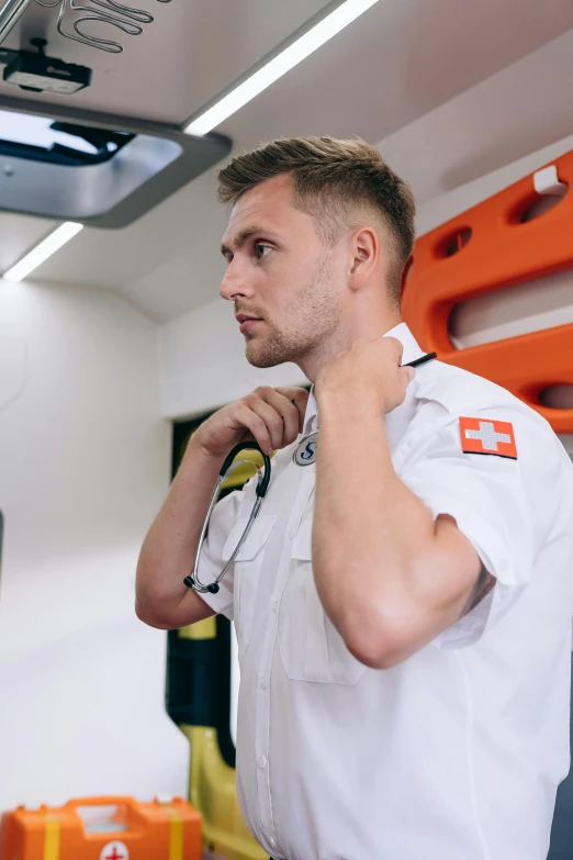 man in uniform standing and looking sideways at soing