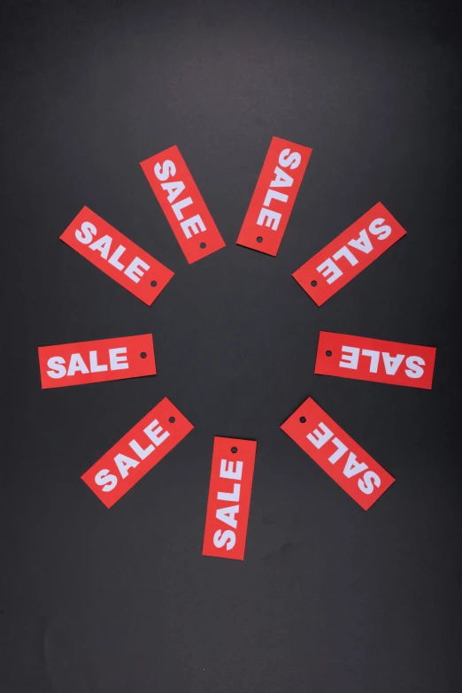 a circular cutout shows sale tags and some smaller labels that say sale