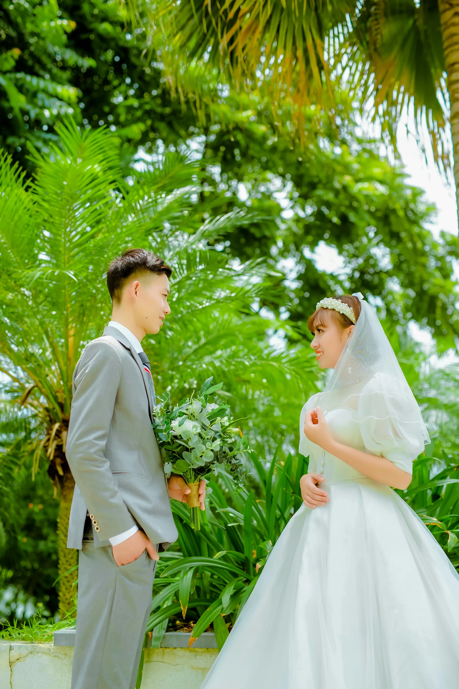 a beautiful young bride standing next to a groom