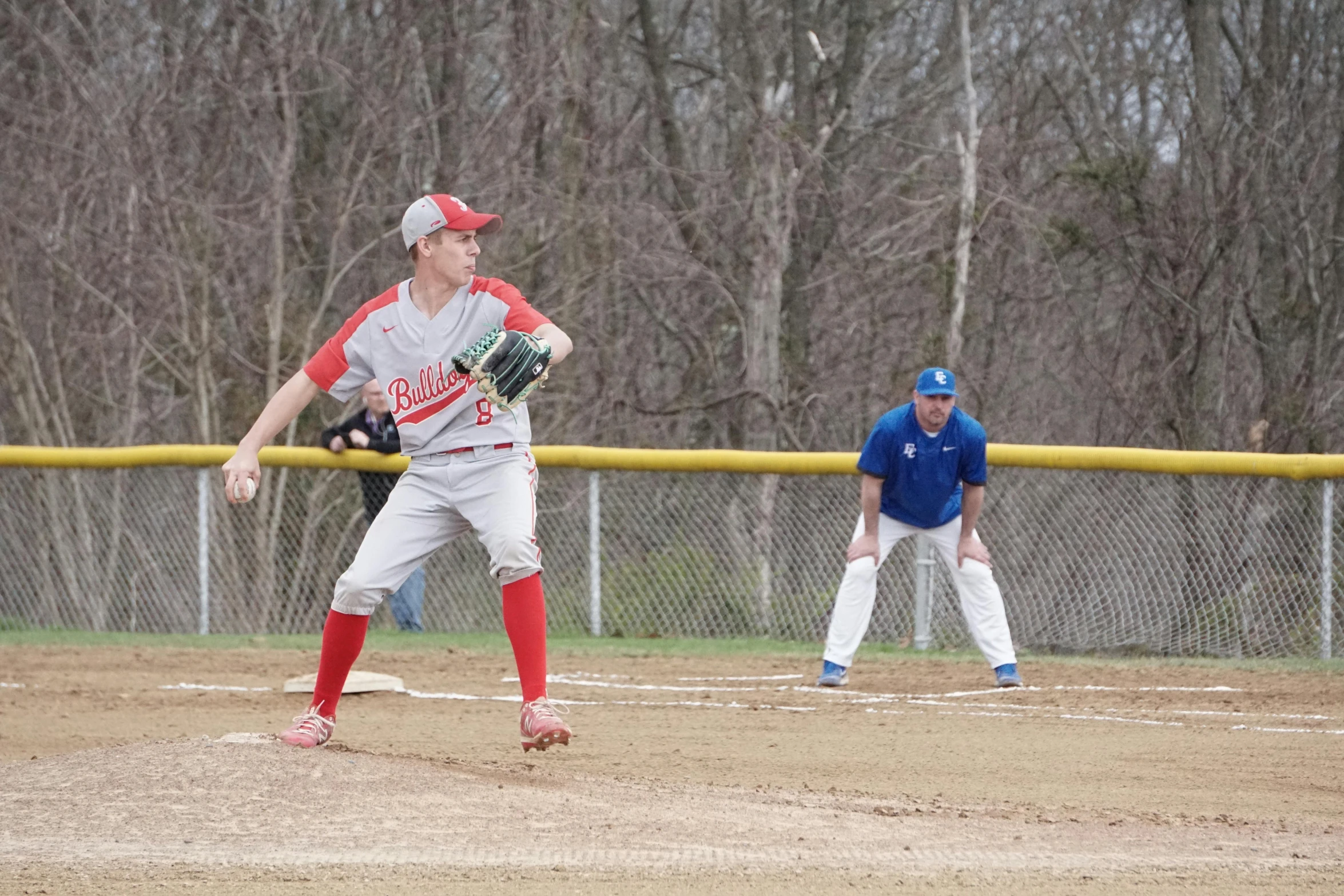 the young baseball player is getting ready to throw a ball