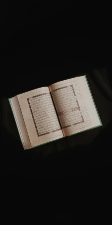 an open book on a dark background