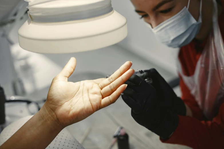 a person wearing a mask, glove and goggles