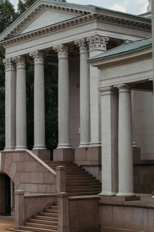 the stone steps of this building have three identical columns