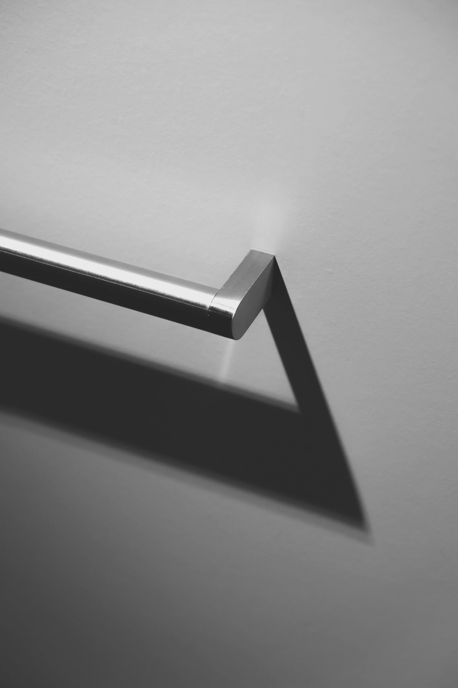 a metal object sitting on top of a white surface