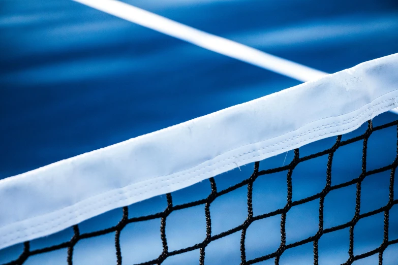 an image of tennis ball at the net