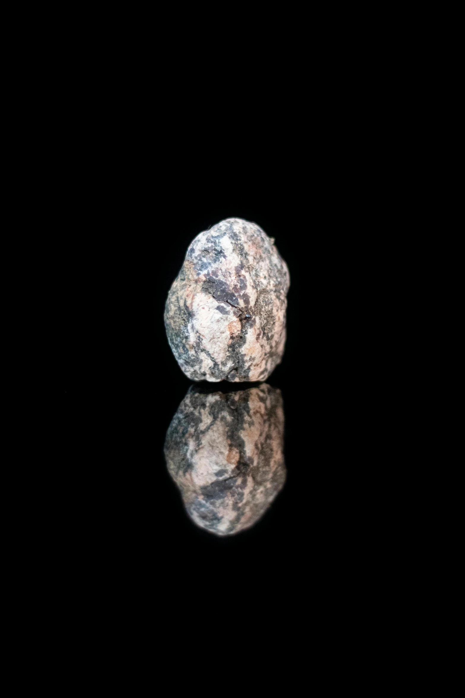 this rock has been set against a black background