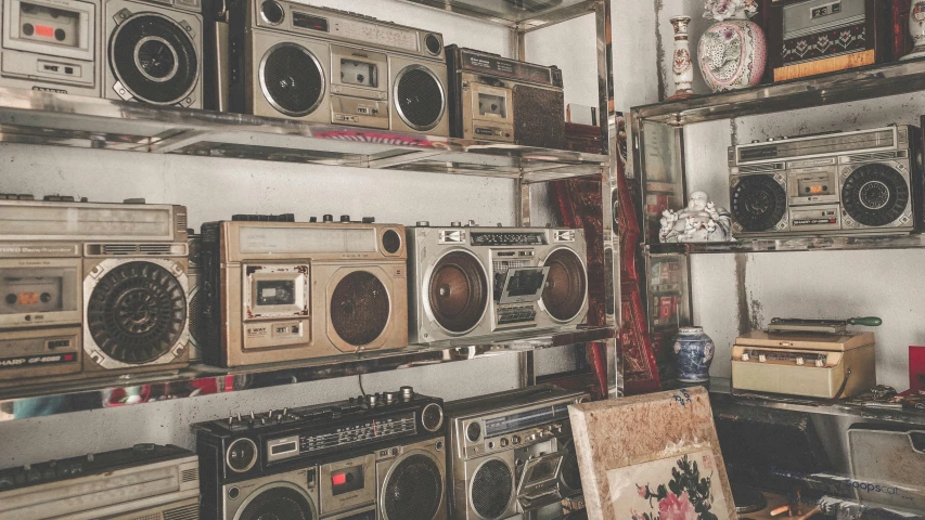 an assortment of vintage radio on a shelf