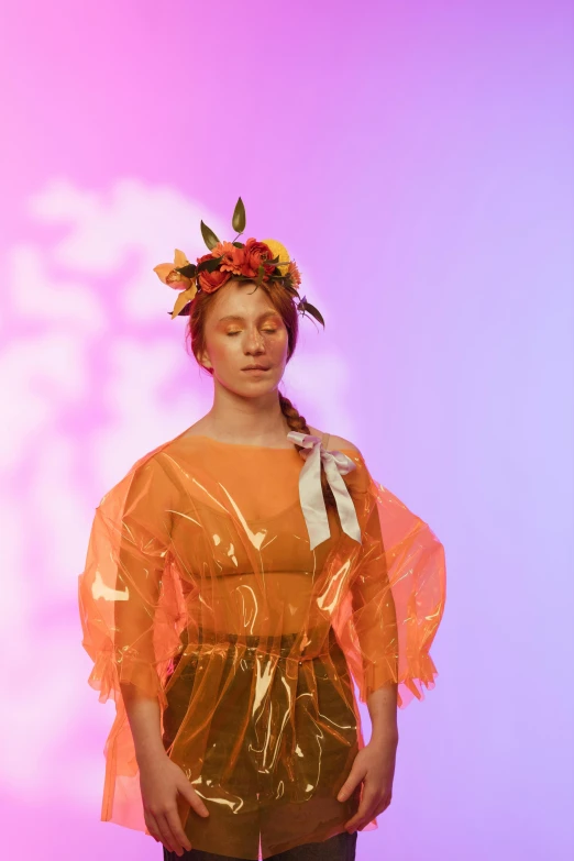 the fashion model is dressed up like an angel with her wings and a flower crown on her head