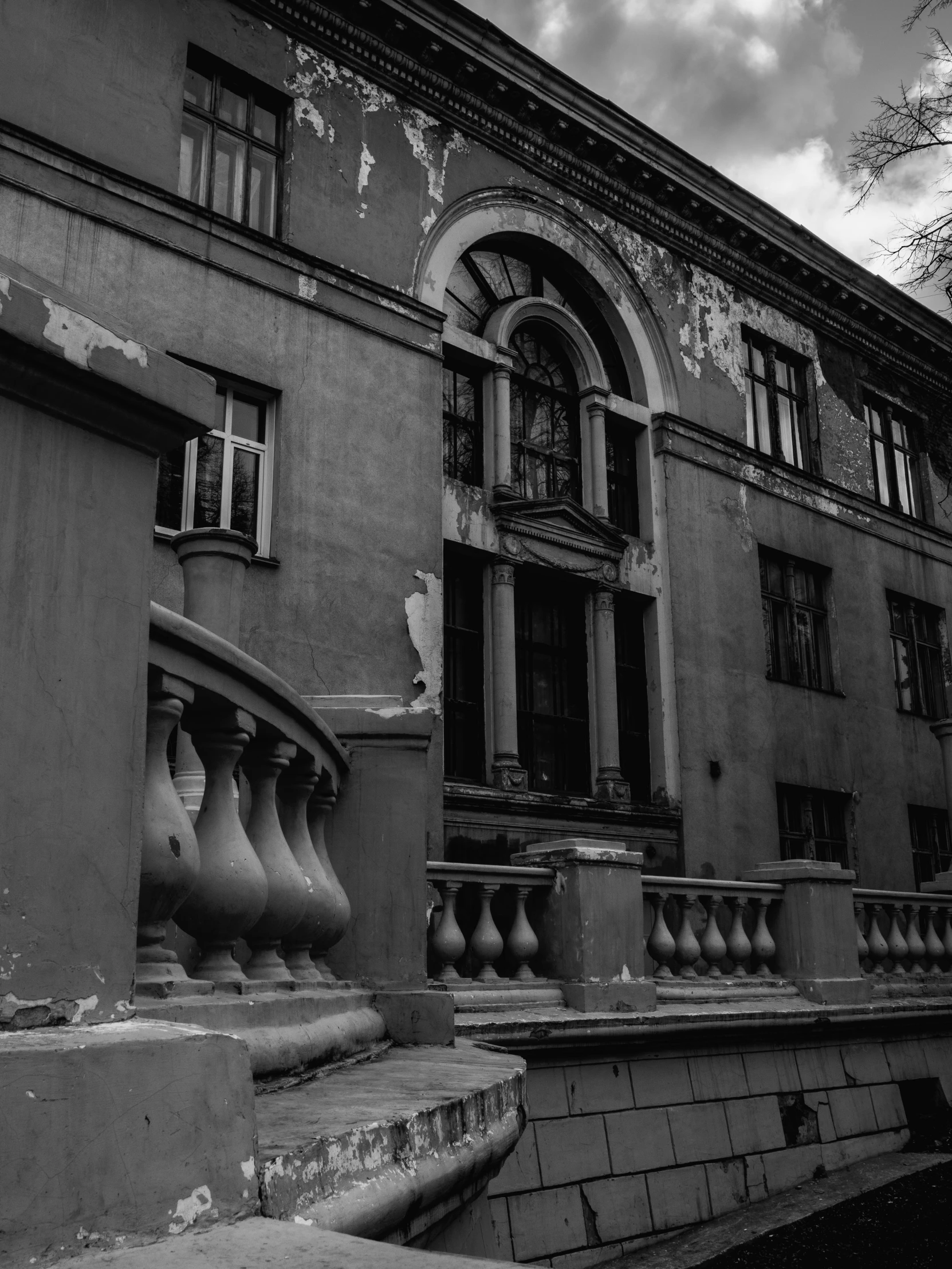 a large building with many stone stairs and railings