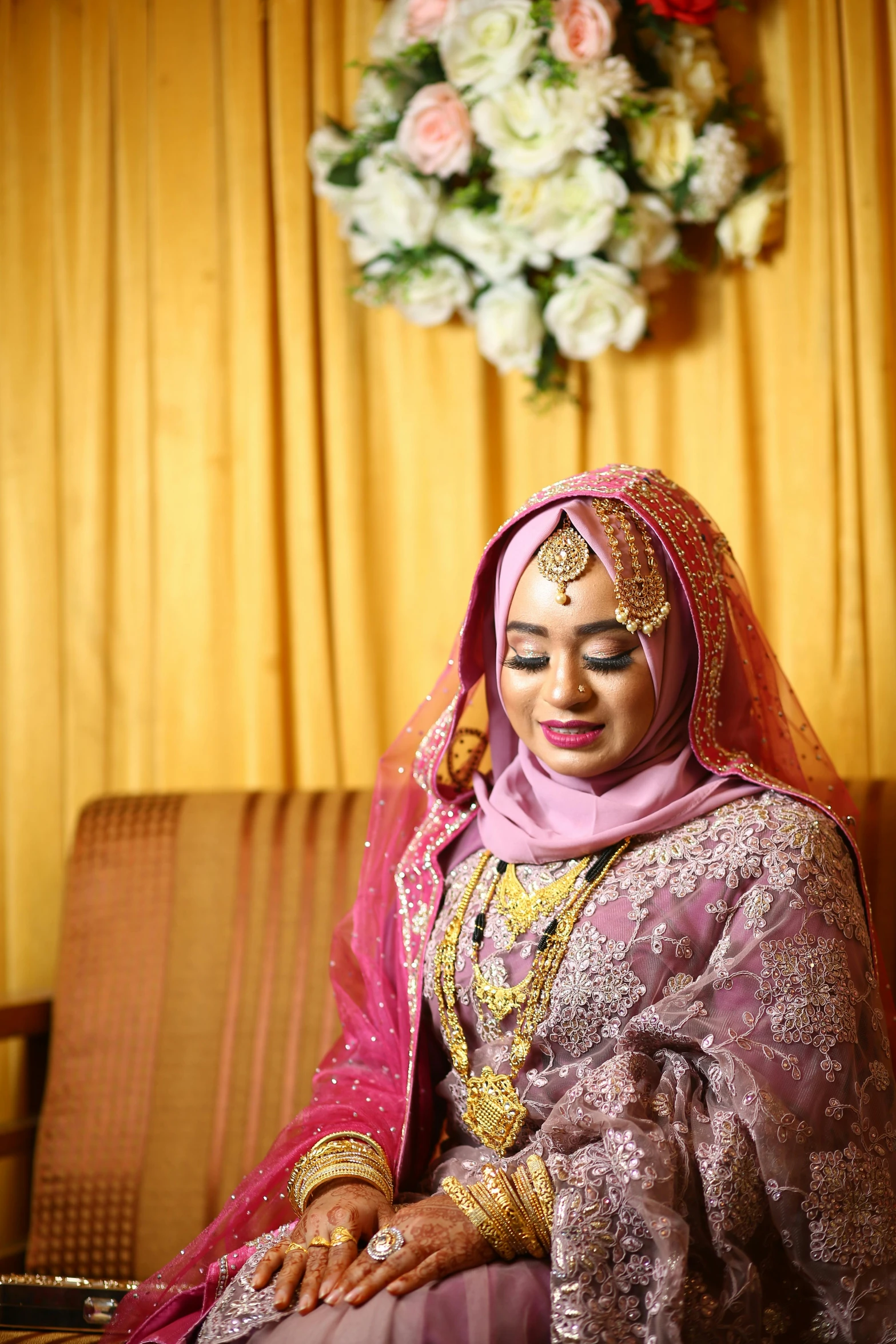 a woman in a purple and yellow bridal outfit