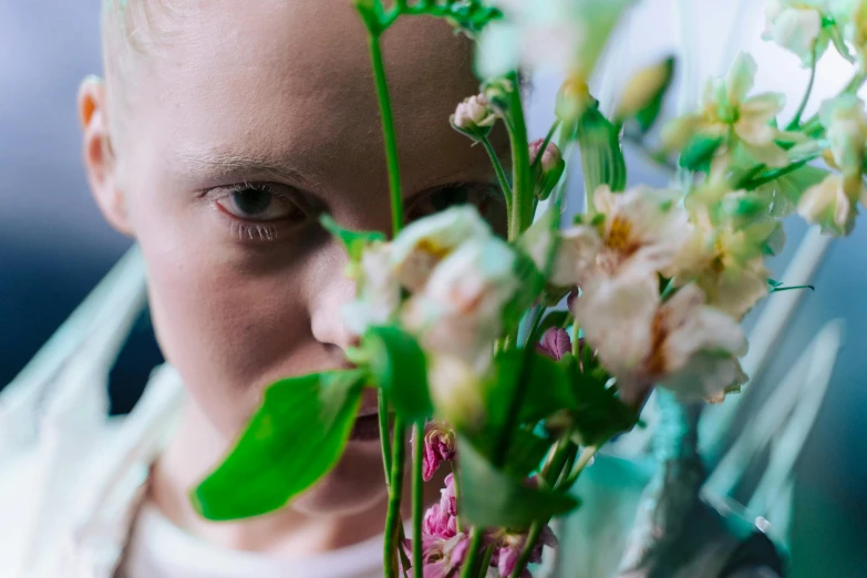 a close up of a child holding flowers