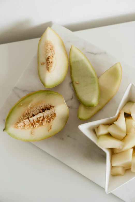 there is some cut up fruits on the table